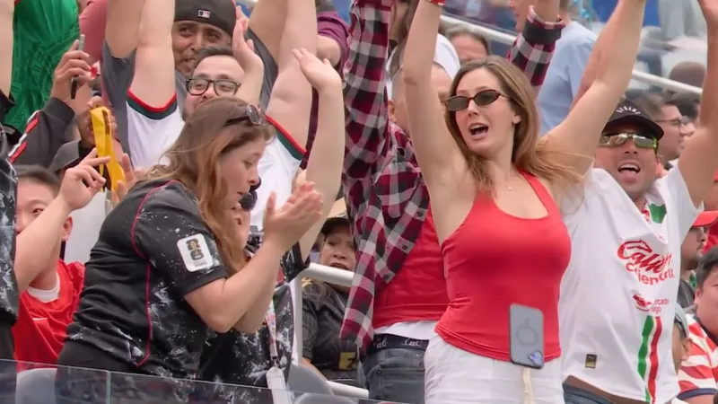 World Cup Fan Loses Phone to Spirited La Ola Wave