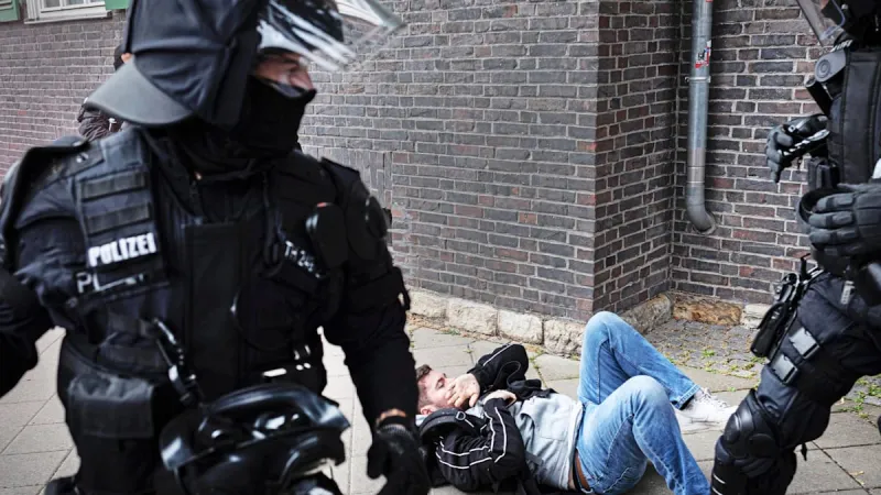 German Protests Turn Violent: Reporters Attacked at AfD Conference