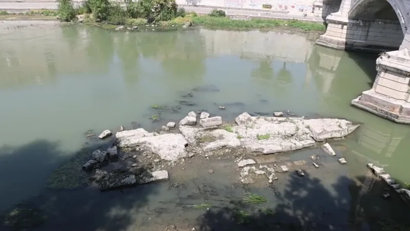Rome's Tiber Reveals Ancient Bridge Amidst Historic Low Water Levels