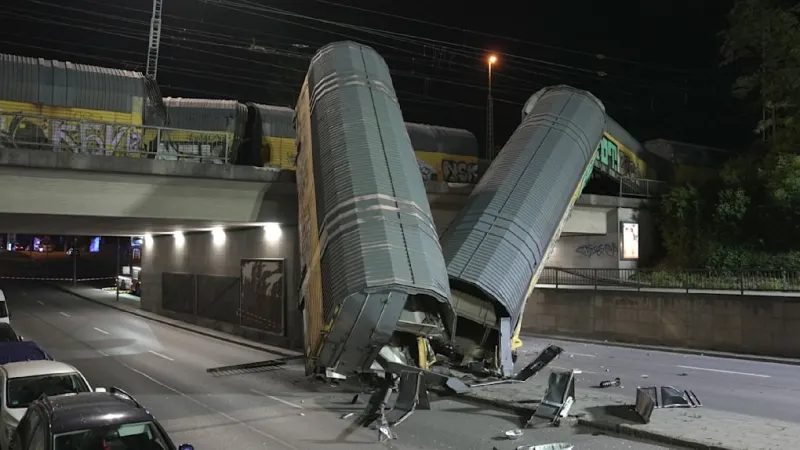 Munich Freight Train Plunge Critically Injures One, Wagons Crash Below
