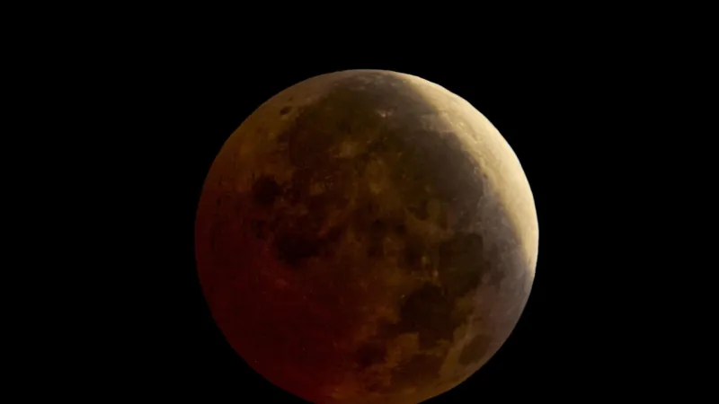 Dawn Sky Transformed by Striking 96% Lunar Eclipse