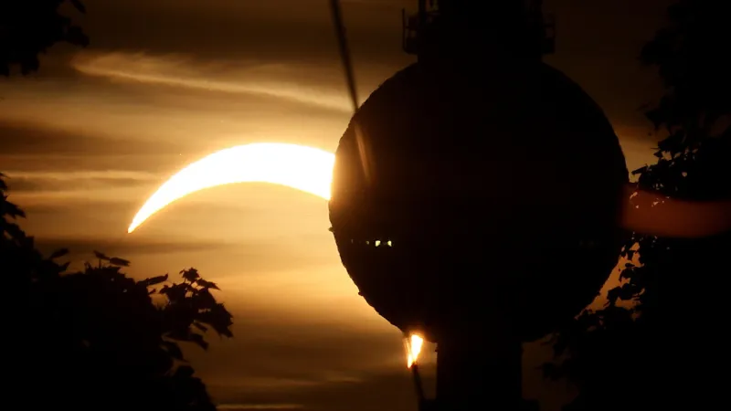 Europe's Sky Ignites: Rare Solar Eclipse Dazzles Despite Cloud Veil